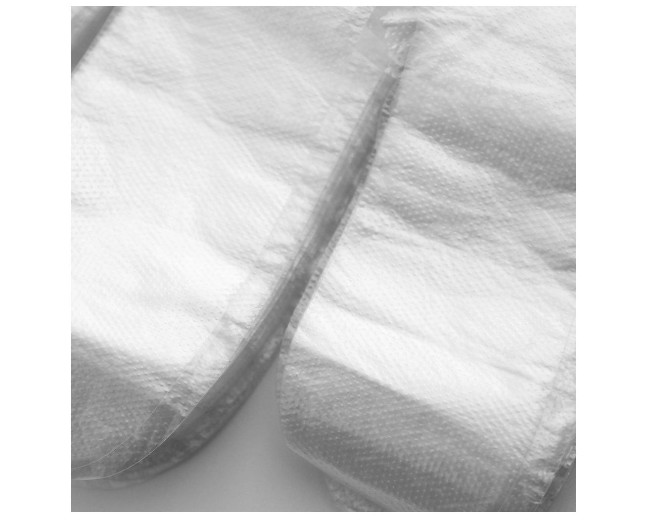 TRT500 Перчатки бесцветные фольгированные сшитые, 100 шт. Merida  - Вид №1